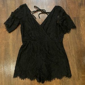 Black lace romper. One tie in the back and one tie in the front!